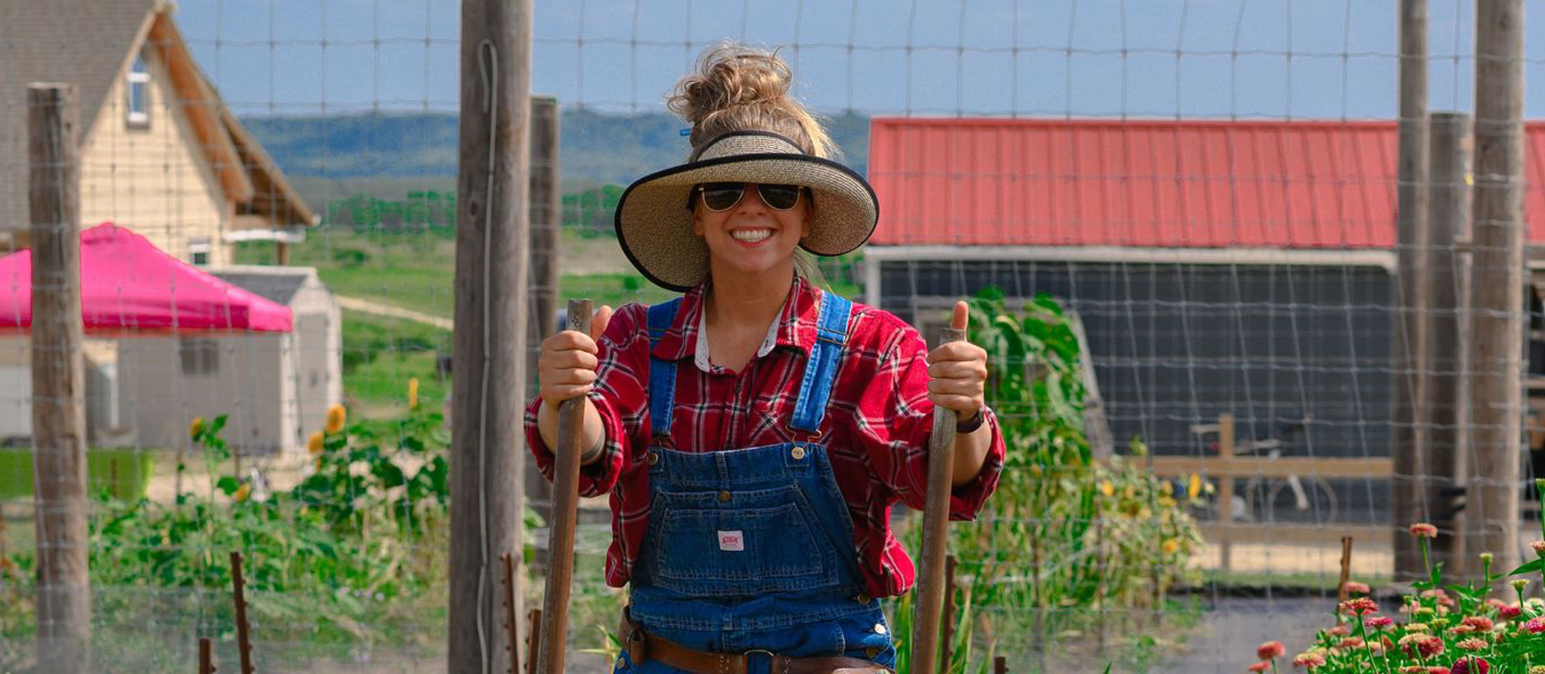 Woman tilling garden.